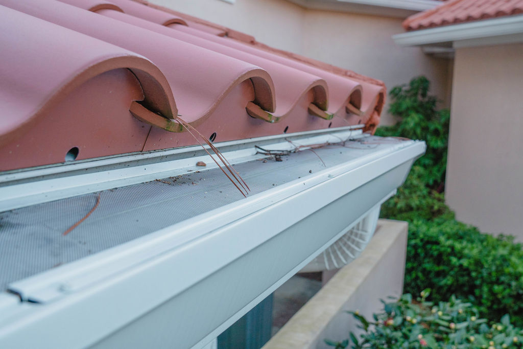 gutter guard on gutters with red roof