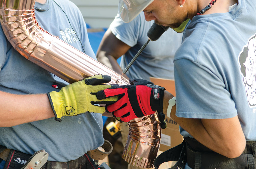 gutter technicians assembling copper gutters